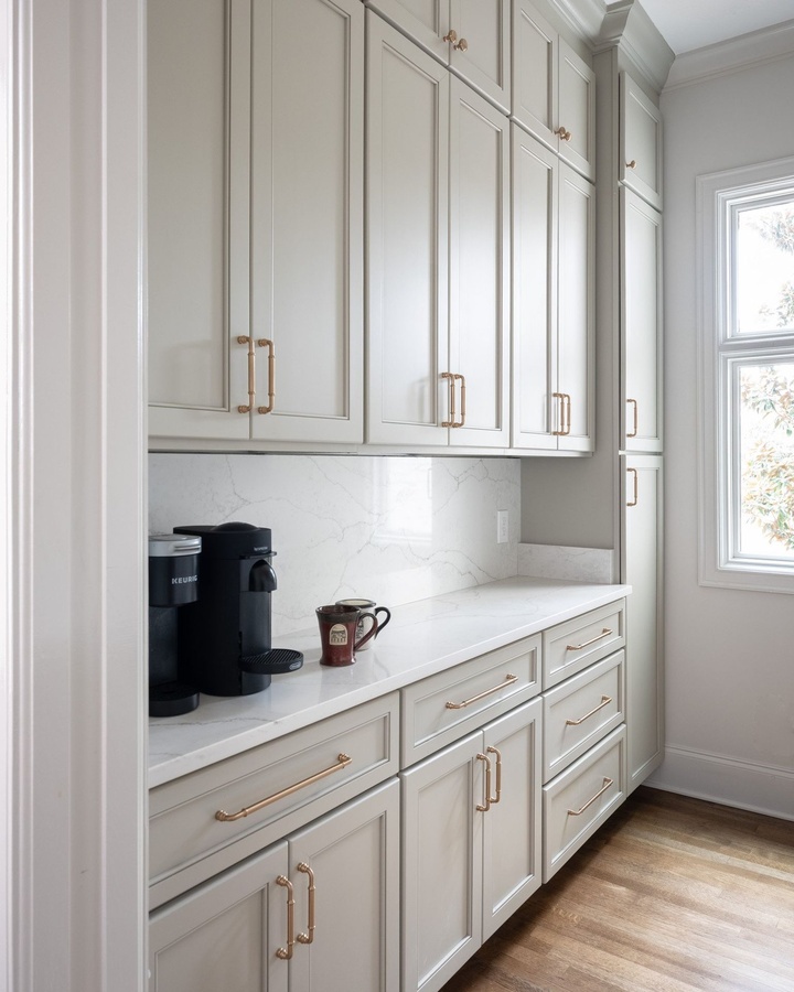 Gray shaker pantry cabinetry by Designer Cabinets