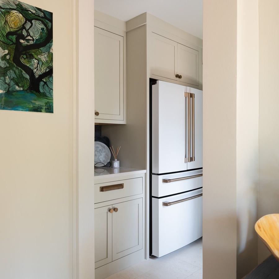 Greige shaker kitchen cabinetry by Designer Cabinets