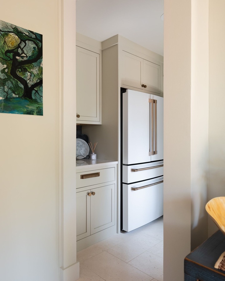 Greige shaker kitchen cabinetry by Designer Cabinets