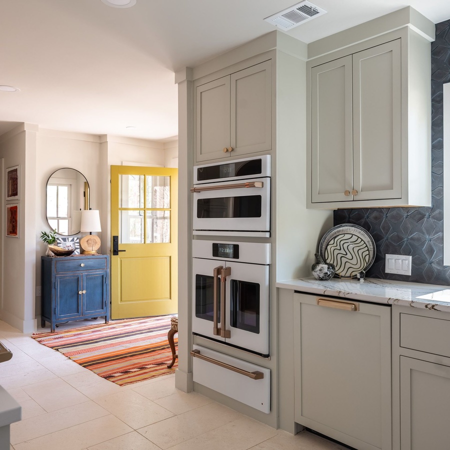 Greige shaker kitchen cabinetry by Designer Cabinets