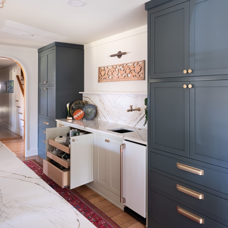 Blue and greige shaker kitchen cabinetry by Designer Cabinets