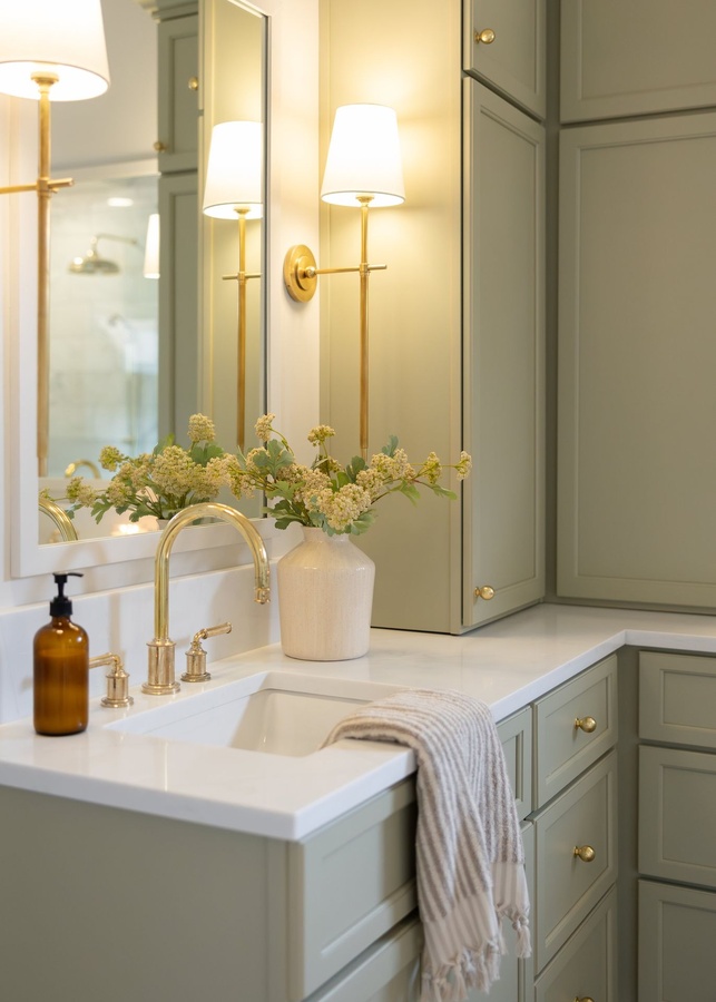 Green shaker bath cabinetry by Designer Cabinets