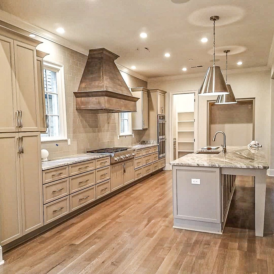 Greige shaker kitchen cabinetry by Designer Cabinets