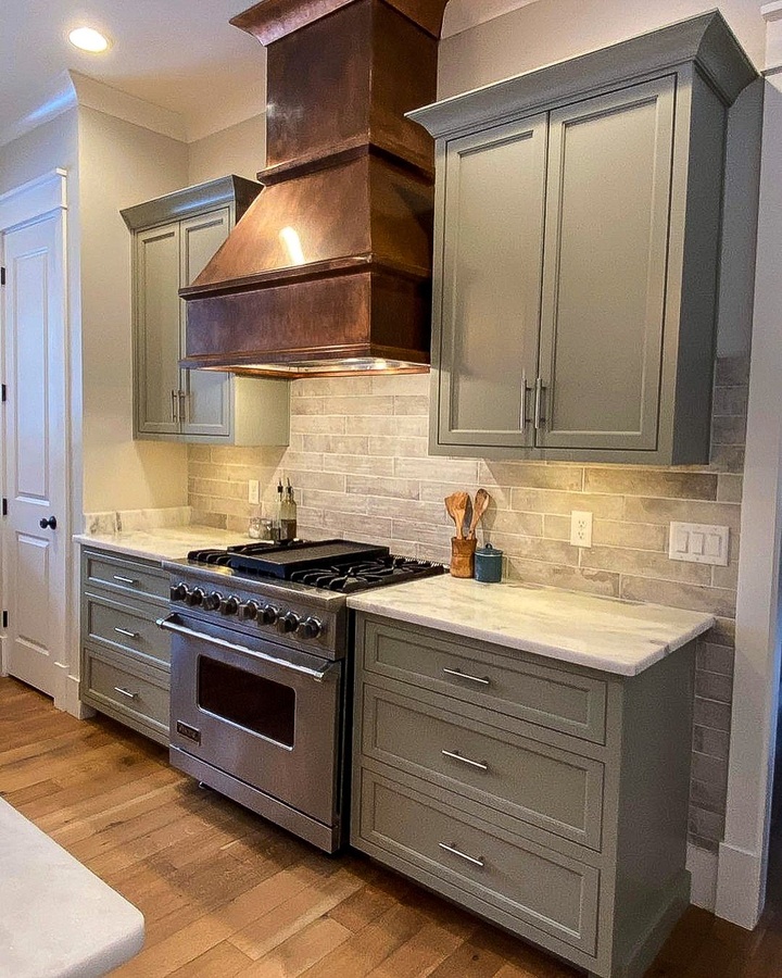 Green shaker kitchen cabinetry by Designer Cabinets