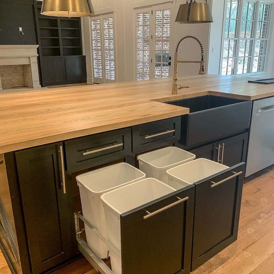 Black and wood farmhouse kitchen cabinetry by Designer Cabinets